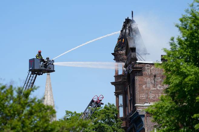 Fire in Fells Point burns through tower of building housing liquor store