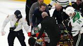 Dallas Stars goalie Scott Wedgewood leaves ice on stretcher after making back-to-back saves