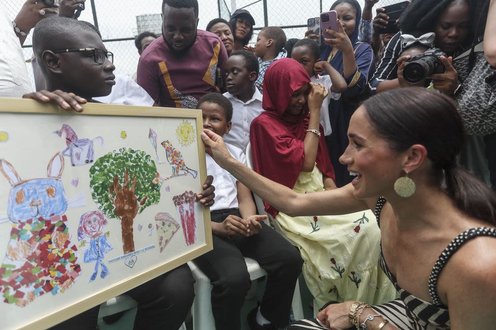 Duchess Meghan Embraces Her Wild Side in Zebra Print on Day 2 of Nigeria Trip