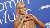 Karol G Shimmers in a transparent Gown Covered in Crystals at Billboard’s Women in Music Awards