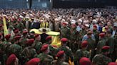 Hezbollah retaliates with rocket salvo after Israel kills senior leader