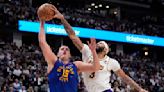 Nikola Jokic leads NBA champ Denver Nuggets past LeBron James and Lakers 114-103 in playoff opener