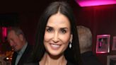 Demi Moore Pairs Classic Navy Blue Gown With Feather Jacket in Ageless Photo