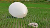Trash dropped by a North Korean balloon falls on South Korea’s presidential compound