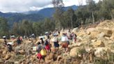 Race to rescue villagers trapped after landslide