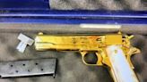 American woman with gold-plated gun in case arrested in Australia