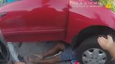 Florida police help rescue man trapped underneath car he was repairing