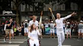 Wounded Lebanese photojournalist carries Olympic torch to honour journalists