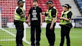 Protestor chains himself to a goalpost ahead of Scotland-Israel women's match