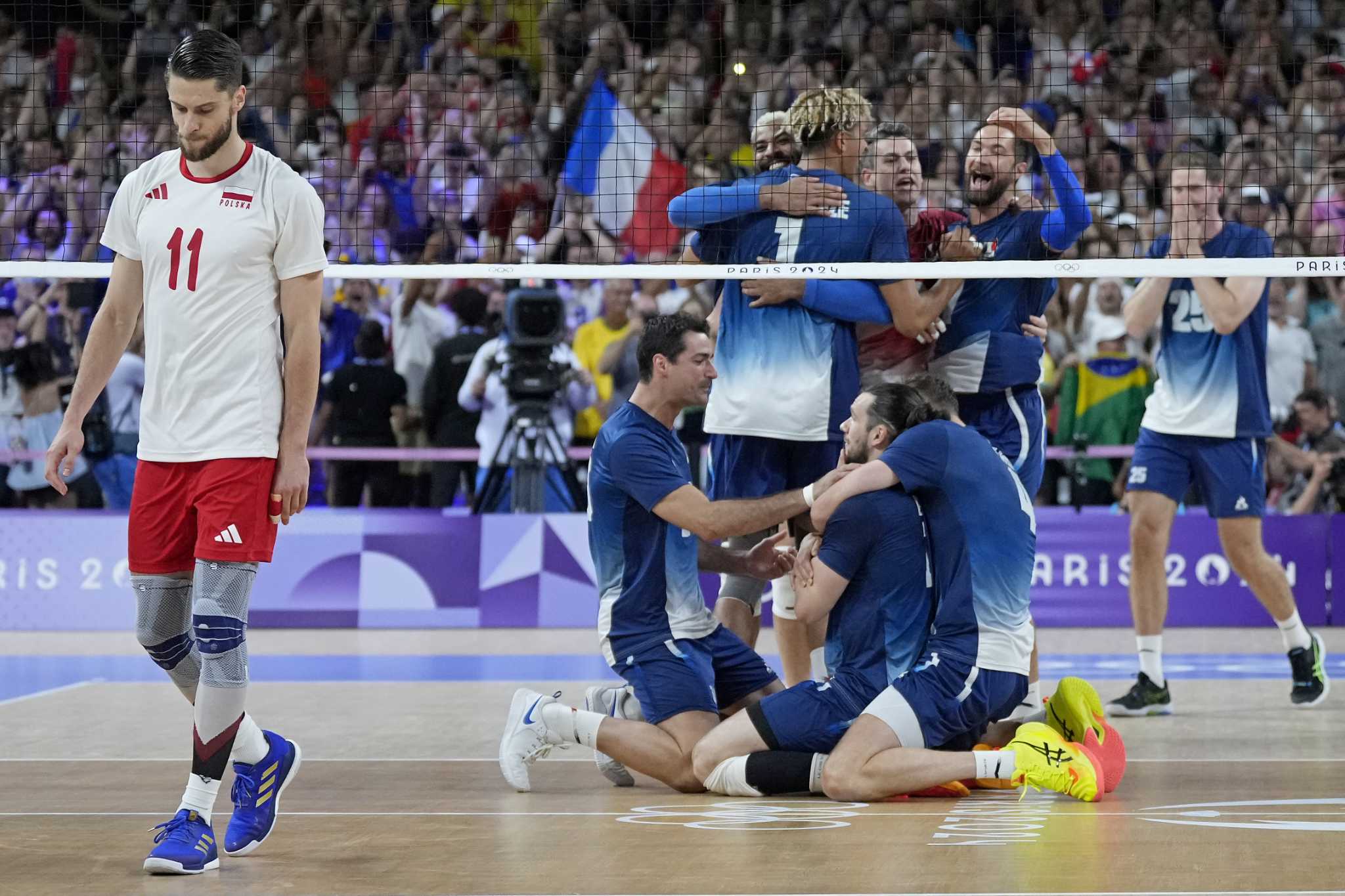 France defends men's volleyball Olympic gold medal, beating No. 1 Poland in front of wild home fans