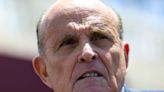 Rudy Giuliani was slapped by a supermarket worker while campaigning for his son in New York