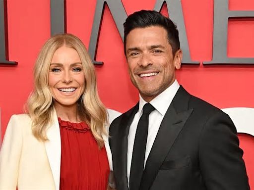 Kelly Ripa and husband Mark Consuelos put on a cozy display as they dress to the nines on Time 100 Gala red carpet