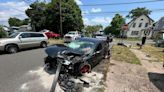 Car collision injuries three and damages a house in Hamden