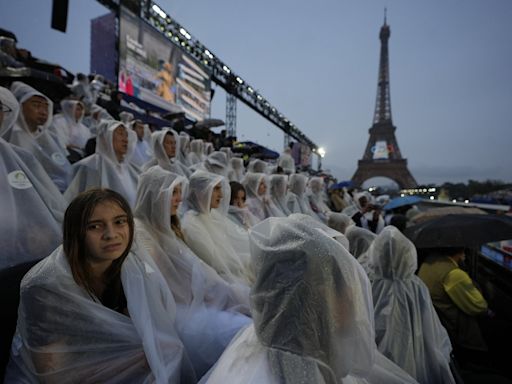 Paris Olympics kicks off with ambitious but rainy opening ceremony on the Seine River