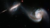 Galactic collisions act as a 'cosmic delivery service' for hungry monster black holes