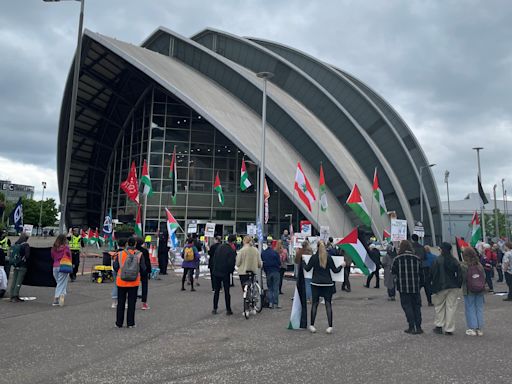 Palestine and climate activists confront Barclays at chaotic shareholder meeting