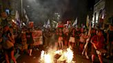 Footage emerges of Israeli police officer pulling protestor by their hair