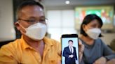 Malaysian dad pleads help for scam victims after son died