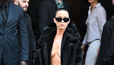 Katy Perry Goes Dares to Go Topless Under an Open Coat at Balenciaga’s Couture Show