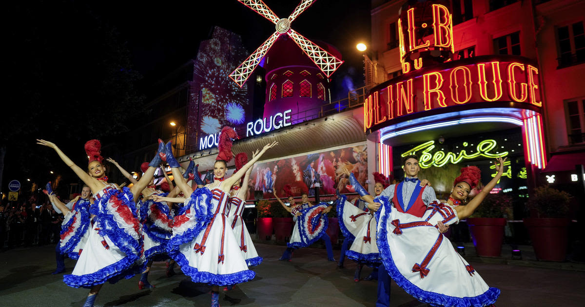 Moulin Rouge's iconic windmill sails restored after collapse just in time for the Olympics