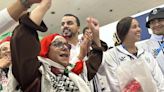 Palestinian Olympic team greeted with cheers and gifts in Paris