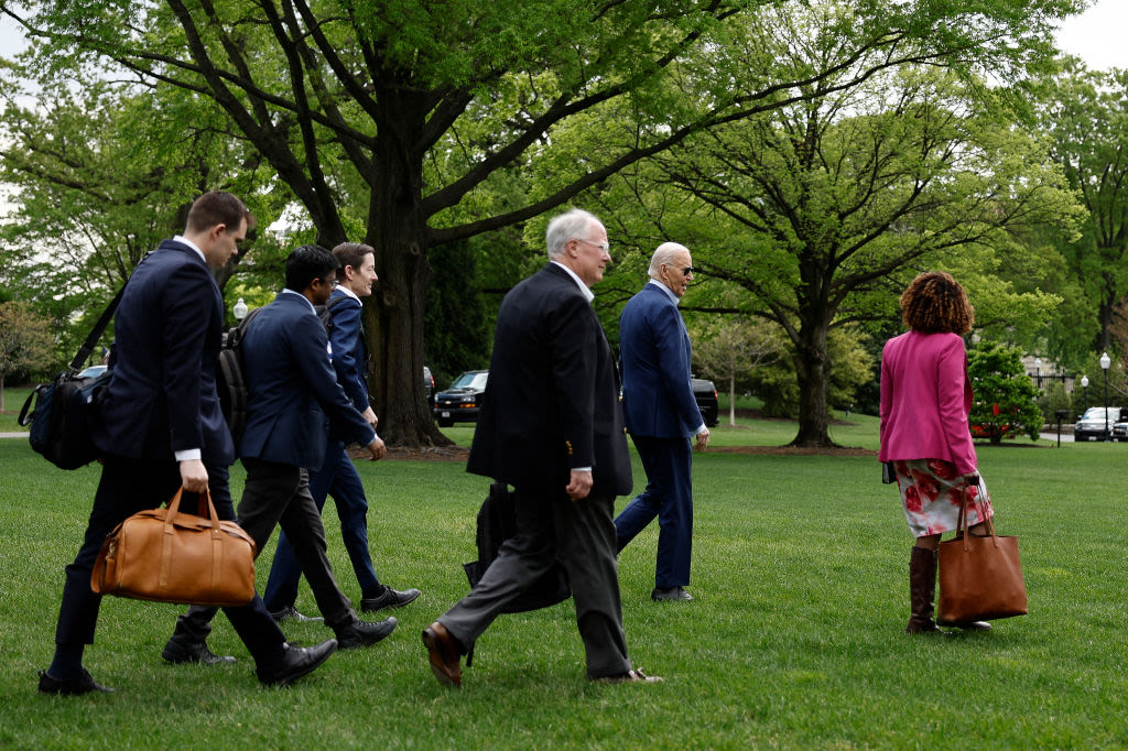 Biden Now Has Aides Walk With Him in Public to Distract From Stiff Gait: Report