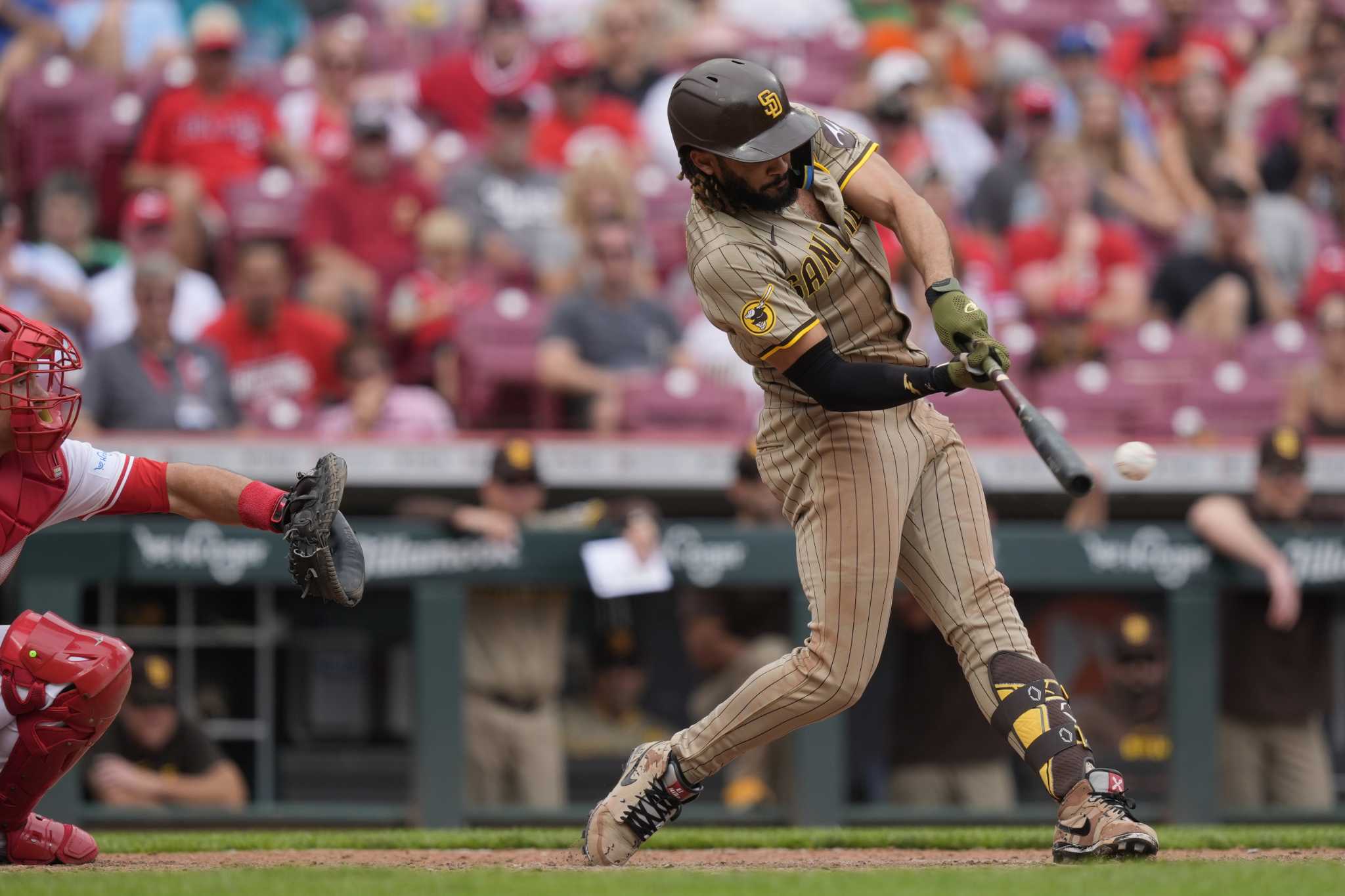 Fernando Tatis Jr. hits a go-ahead double in the 10th inning as the Padres beat the Reds 6-4