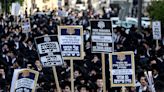 Israeli military says it will begin drafting ultra-Orthodox men. That could rattle the government