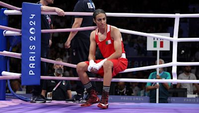 Boxer facing gender questions wins as foe quits