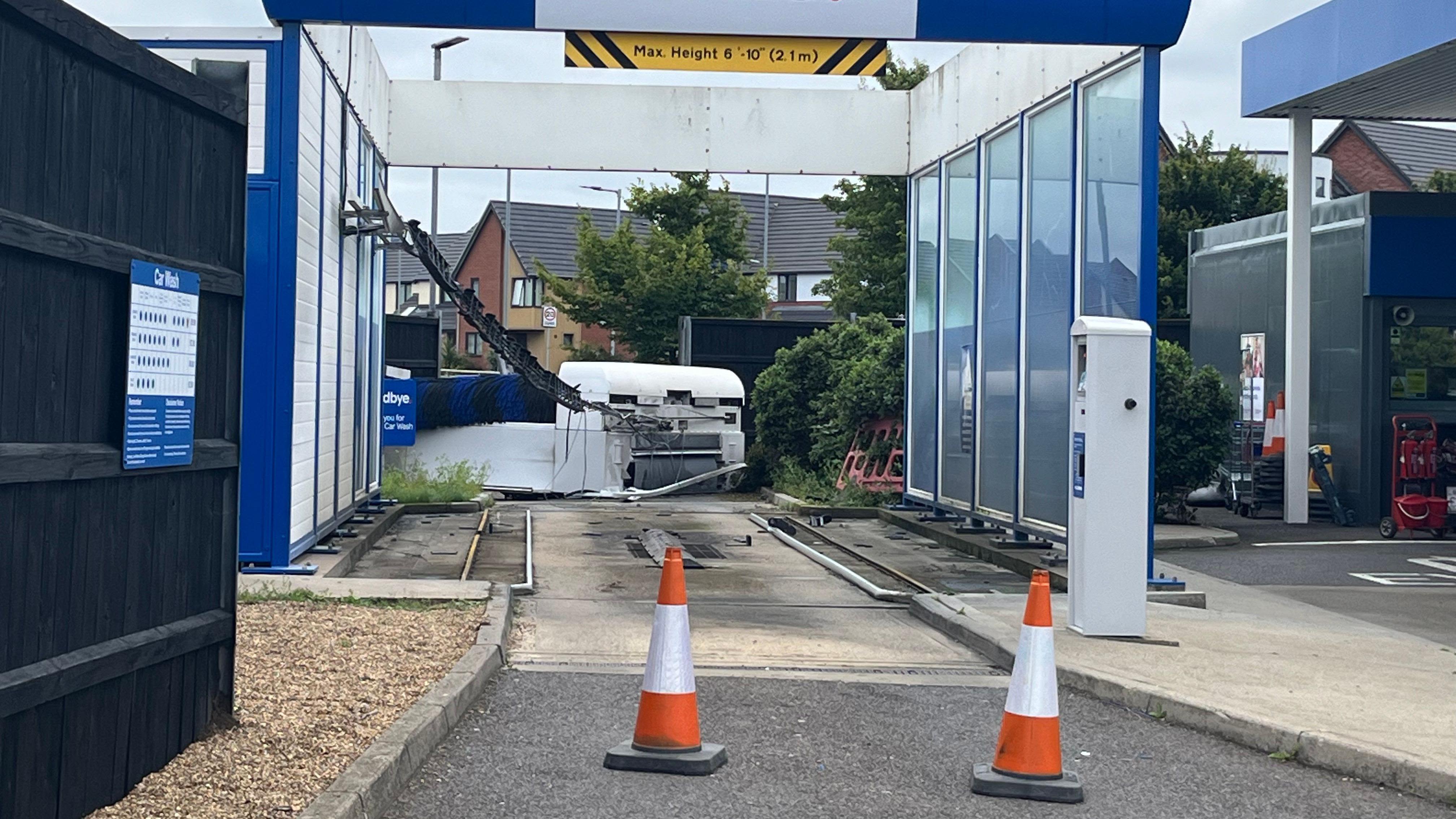 Car wash damaged after being struck by car