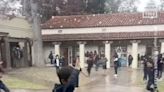 Video captures excited schoolchildren in California enjoying the novelty of playing in hailstorm