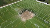 Giant sinkhole swallows middle of Illinois football field