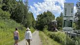 Hikers and cyclists can now cross Vermont on New England's longest rail trail, a year after floods