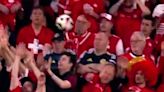 Swiss fan hit by ball - but Scots supporter's reaction is priceless