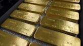 Gold retreats as dollar gains upper hand