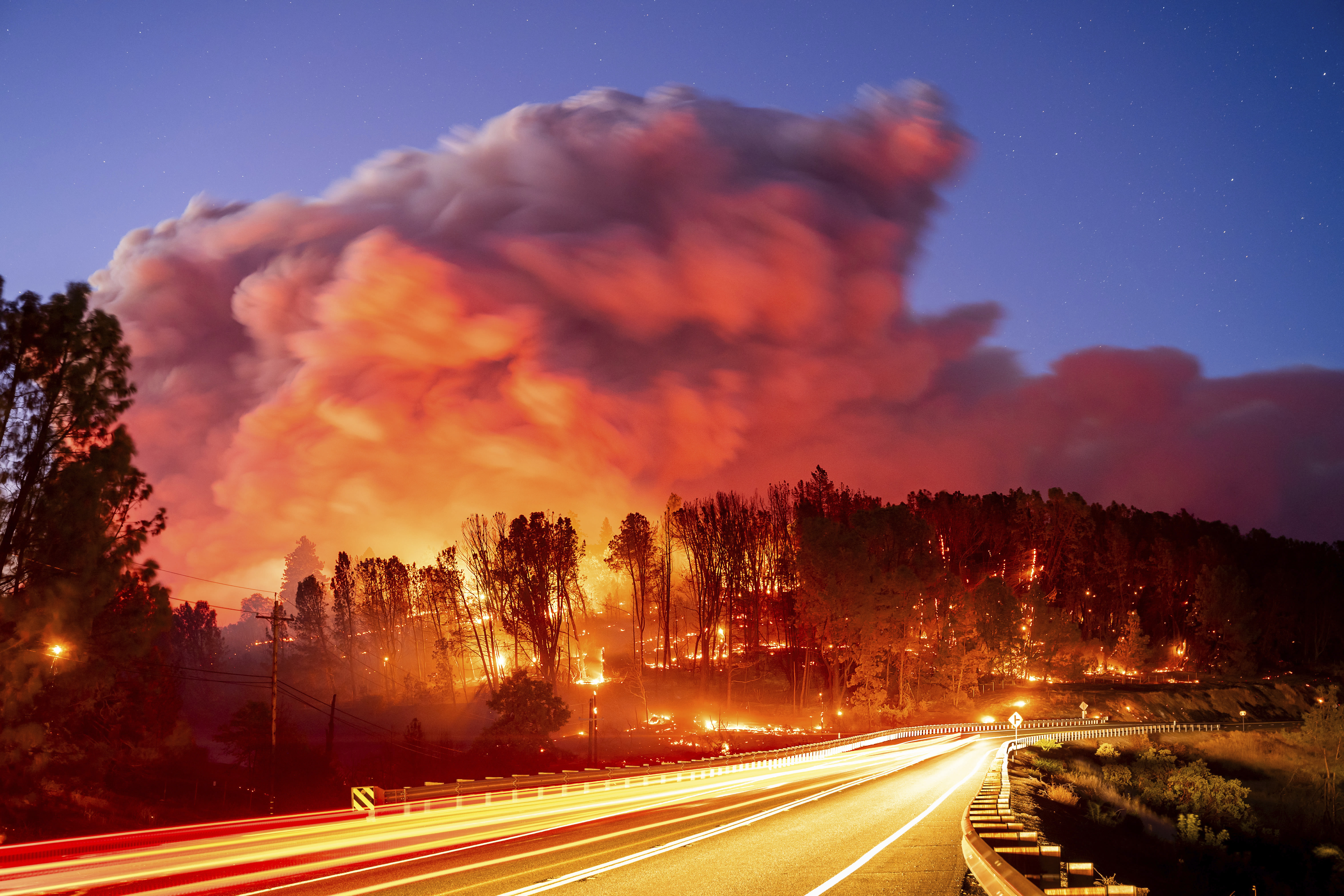 Wildfire sparked by a burning car triples in size in a day. A 42-year-old man is arrested