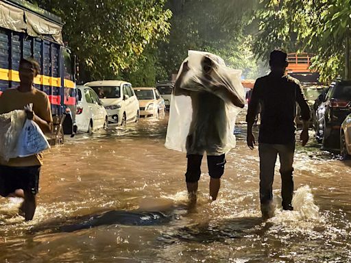 Mumbai rain: 14 flights diverted, local trains affected; red alert for Palghar | Maharashtra weather updates