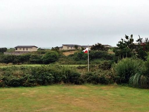 Neighbours' six-year fight over caravan park they say spoiled their idyllic sea view