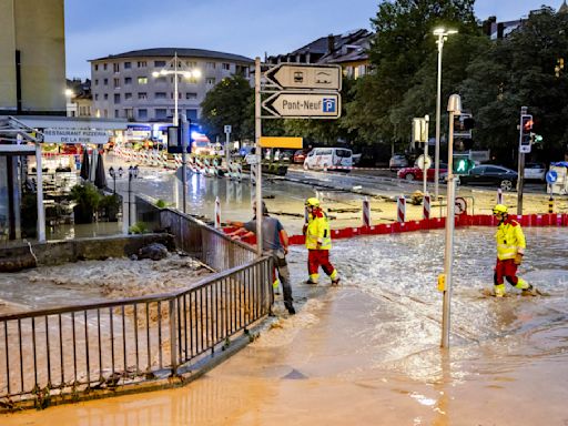 Swiss inspect the damage after sudden storms flood roads, halt air traffic in Geneva