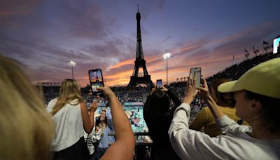 Beach volleyball at Eiffel Tower stadium draws crowds looking for perfect photo