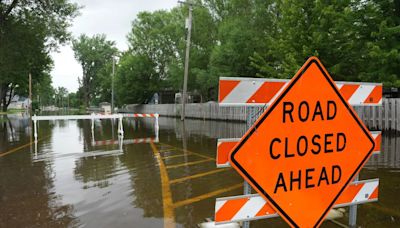 Floodwaters inundate Minnesota towns while another storm transformed New Mexico village into a lake