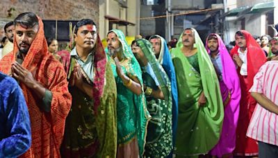 Why do men dress up as women for Garba during Navratri in Ahmedabad?