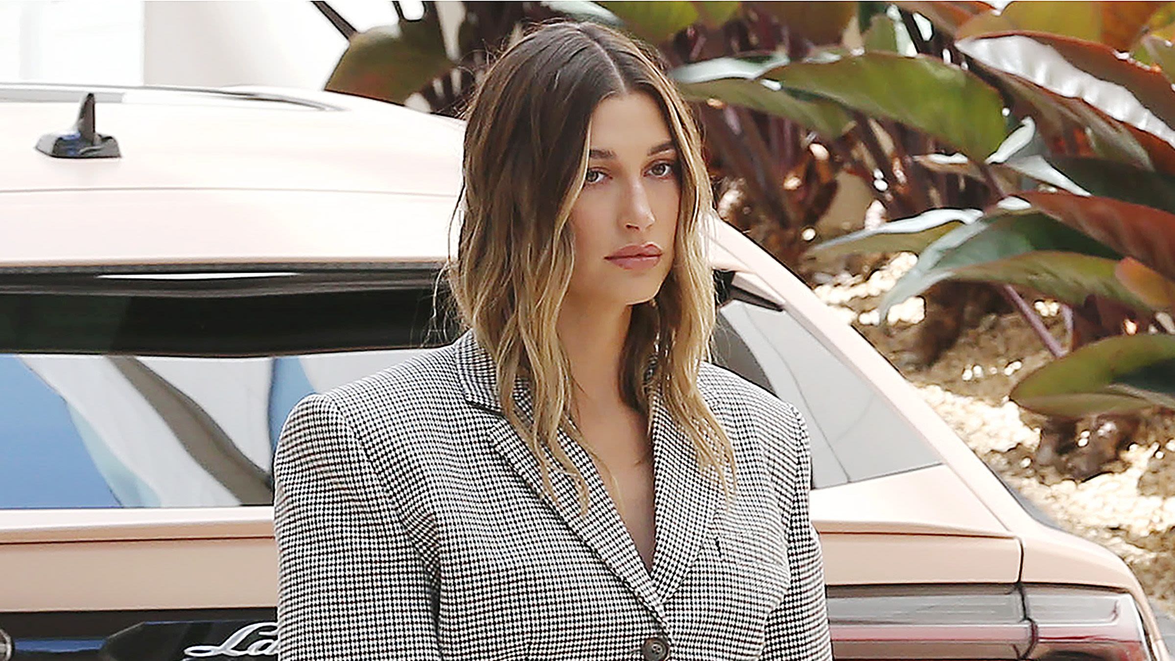Hailey Bieber Paired A Crop Top With An Oversized Blazer In First Outing Since Pregnancy Announcement