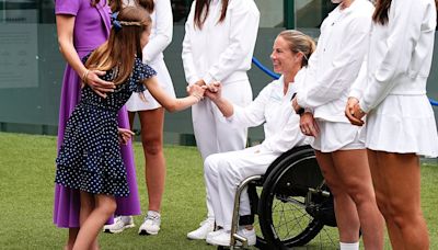 Princess Charlotte makes a Pinky promise with Lucy Shuker at Wimbledon