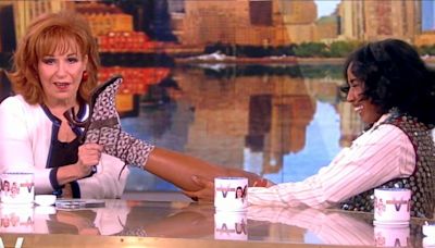 Joy Behar bizarrely holds Ayo Edebiri's foot on 'The View's Hot Topics table: "I'm not releasing her!"