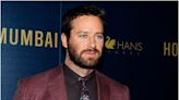 Armie Hammer isn't working as a hotel concierge in the Caymans — but his friends fooled the internet into believing he is