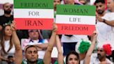 Barred from stadiums at home, Iranian women travel to World Cup