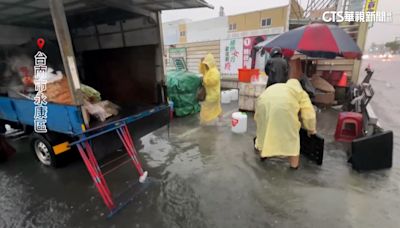 午後雷雨炸台南 永康水淹腳踝人孔蓋狂噴水