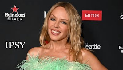 Kylie Minogue, 55, is a 'golden' goddess in risqué outfit for beachside video