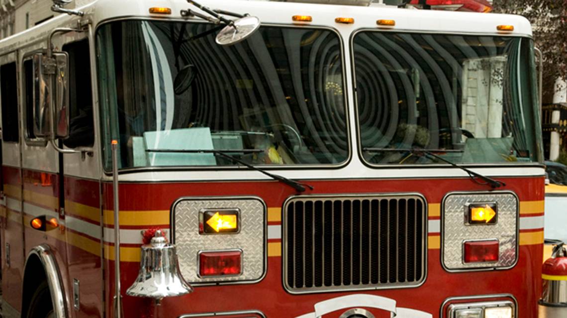Kansas City firefighters rescue man suspended upside down in tree, dangling by foot
